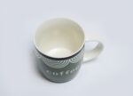 green coffee mug - فنجان قهوة