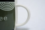 green coffee mug - فنجان قهوة